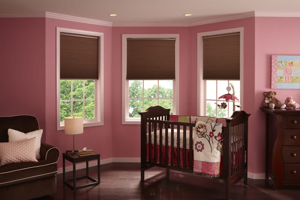 Nursery with cell window treatments by Architectural Window Treatment