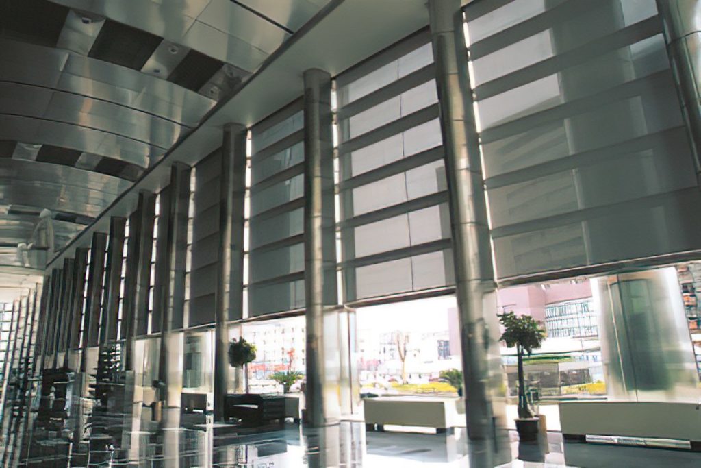 An office lobby area equipped with automated blinds installed by Architectural Window Treatments.